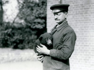 A Keeper Holds a Sloth Bear Cub at London Zoo, August 1921 by Frederick William Bond